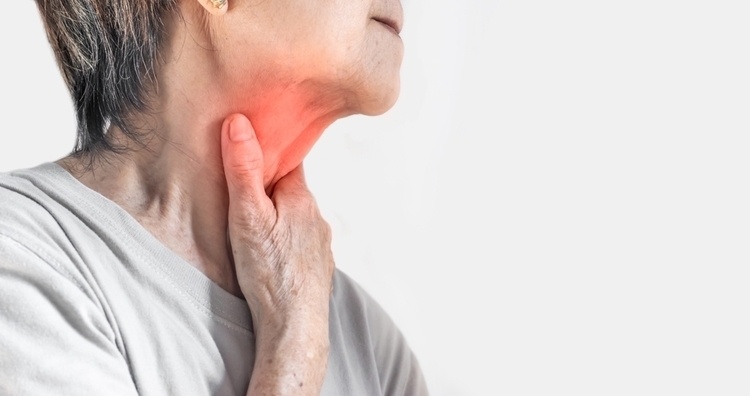Redness at the neck of woman. Concept of sore throat, pharyngitis, laryngitis, esophagitis, thyroiditis, or dysphagia.